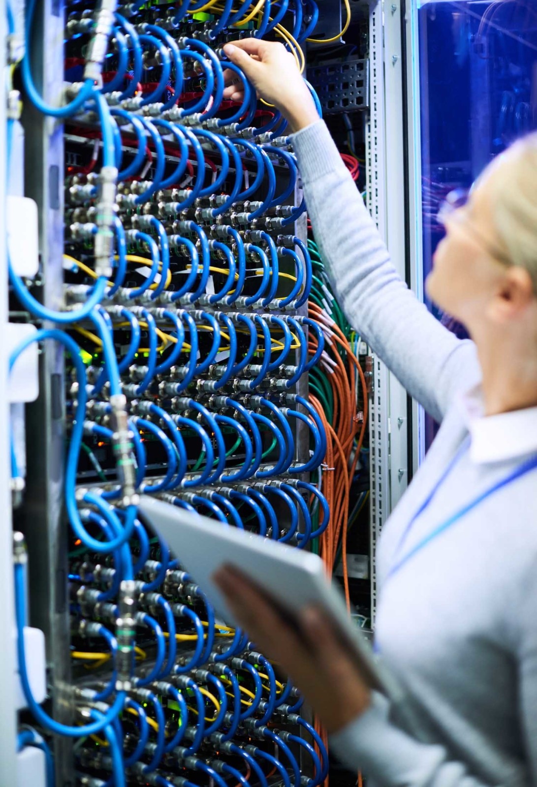 Woman adjusting server cables